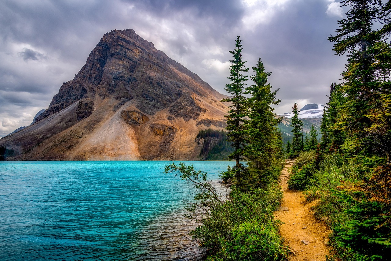 mountain, landscape, snow, peak, clouds, summit, tibet, lake, travel, sea, sunset, rocks, outdoors, sky, trees, fog, green, flora, garden, botany, jungle, foliage, spring, island, ai generated